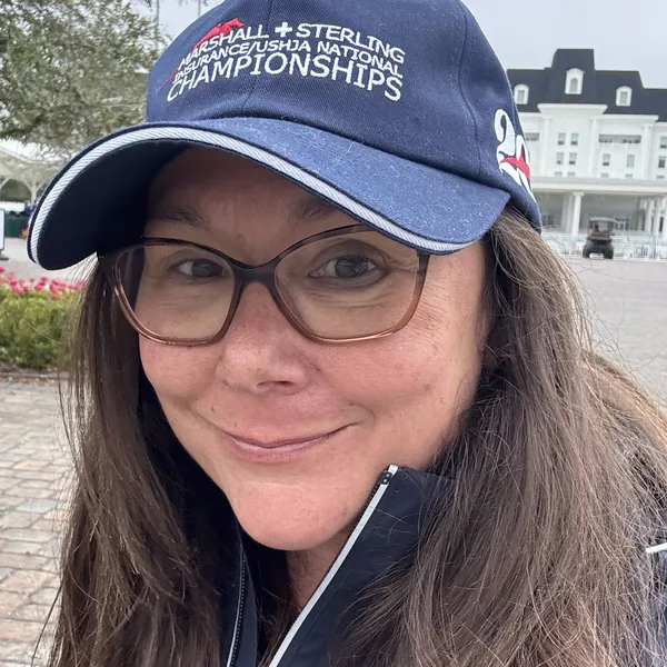 Marti Smith, founder of High Altitude Equine, at WEC Ocala in a Marshall & Sterling National Championships cap